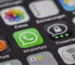 Detailed macro of smartphone screen showcasing popular app icons like WhatsApp.